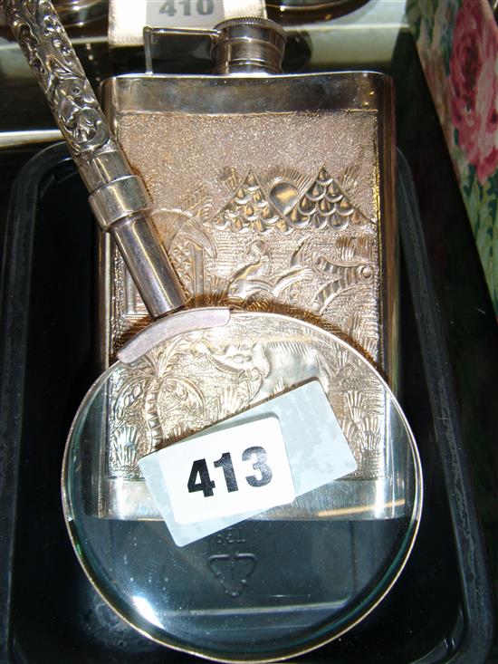 Indian silver flask and a magnifying glass